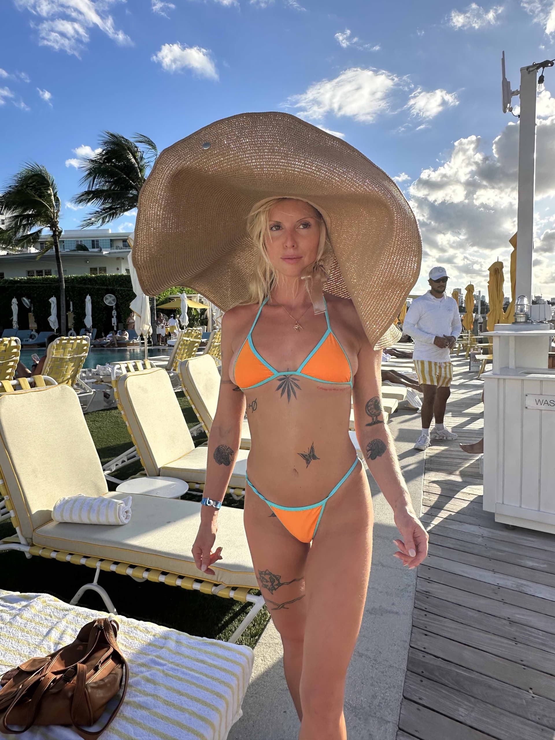 Oversized wide brim sun hat side view - resort lifestyle luxury sun protection